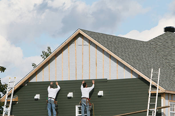 Professional Storm Damage Siding Repair technician working in Milford, OH